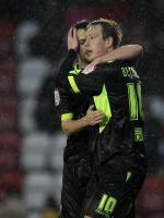 Redfearn starts with a win against nine men